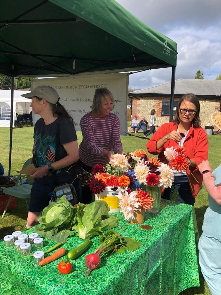 setting up stall at the Mayday Fair