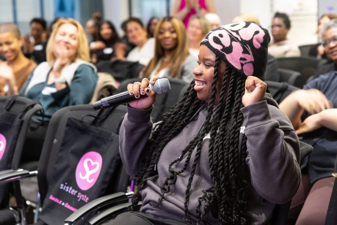 Sister System person in meeting